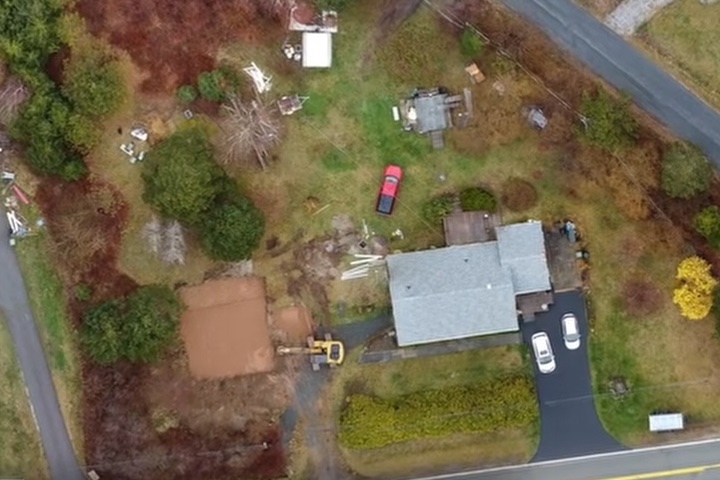Construction site plan overlaid on an aerial map